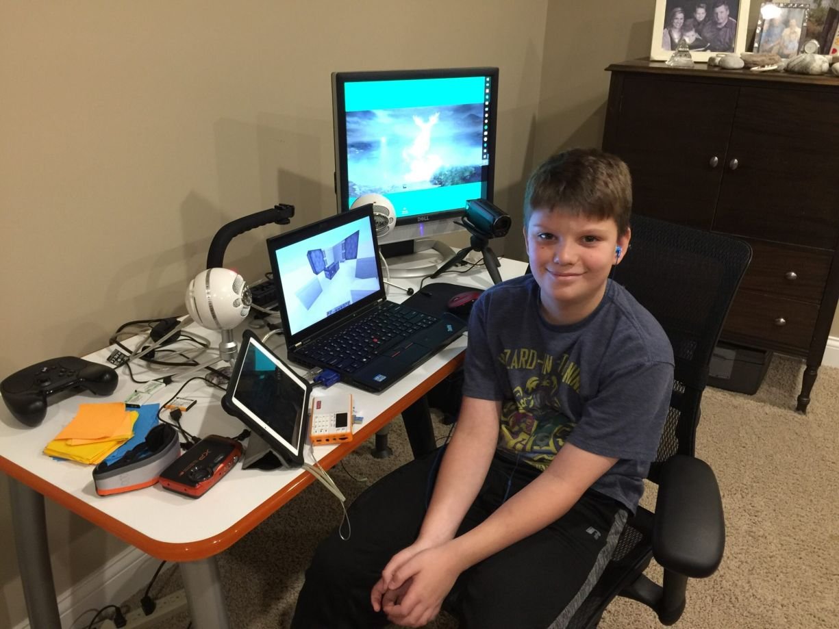 Pieter de Bruijn at his desk surrounded by tech